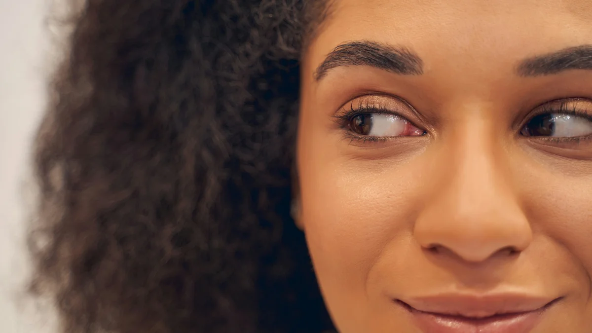 Close-up of a smiling woman’s eyes with neat, well-defined brows